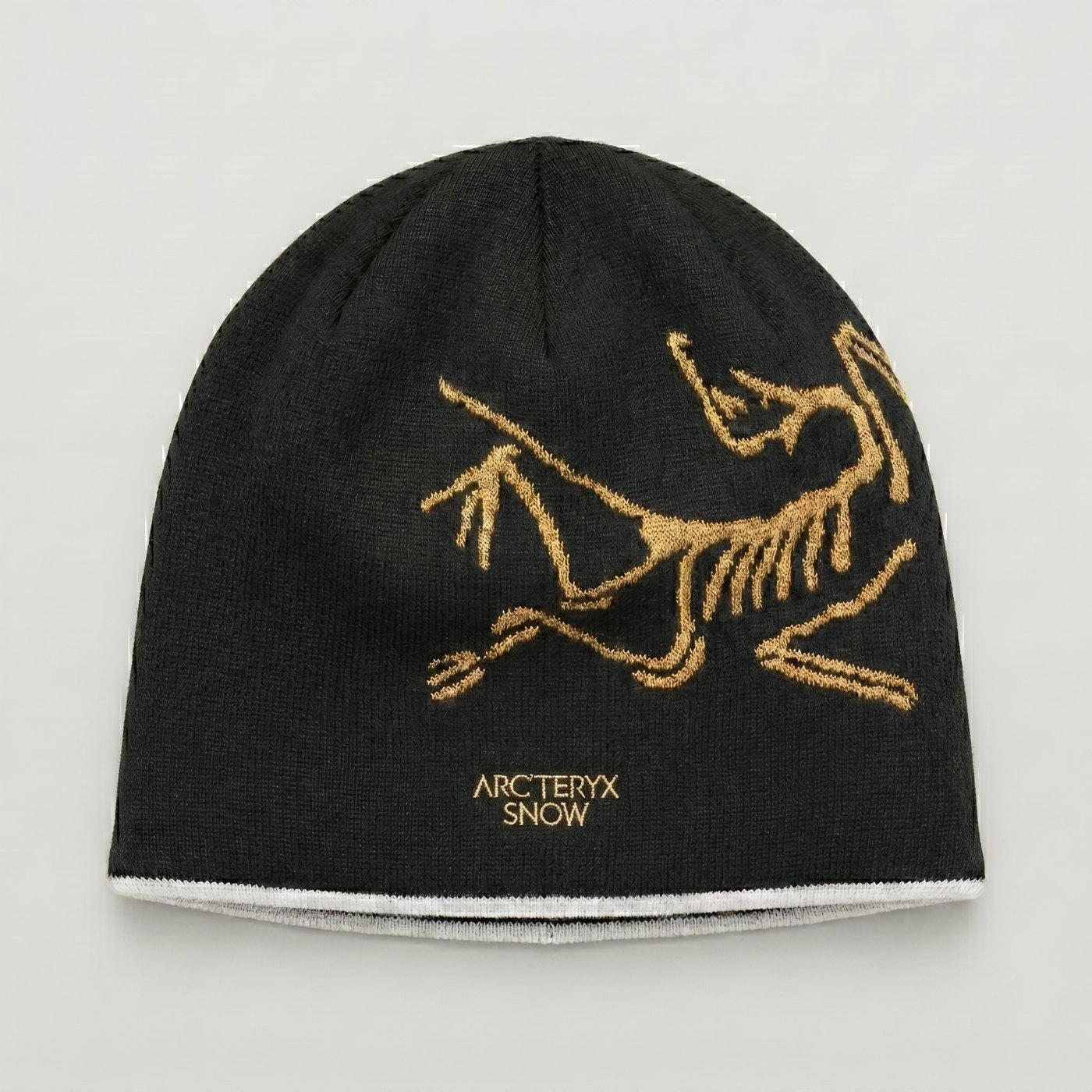 Merino blend beanie with gold bird logo
