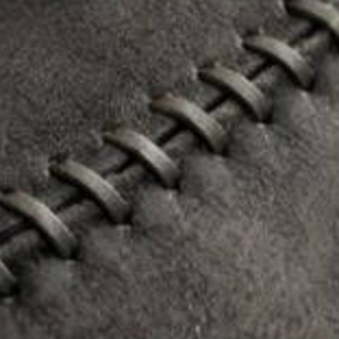 Rawhide whipstitch lacing on suede
