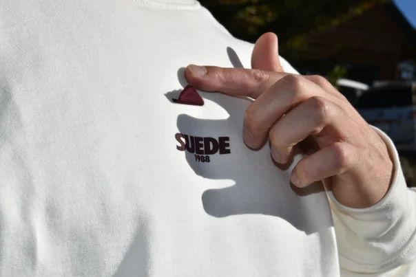 Detail — signature suede flap