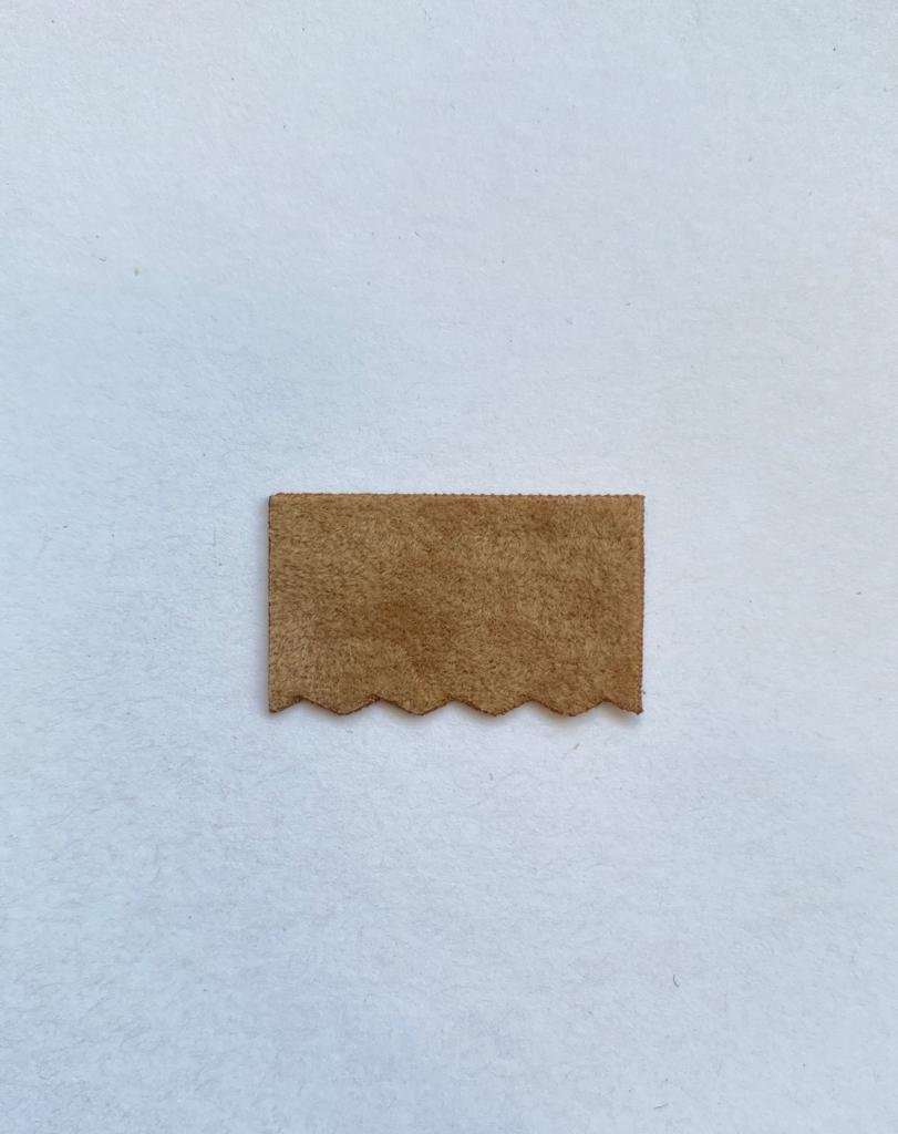 The scalloped suede flap swatch